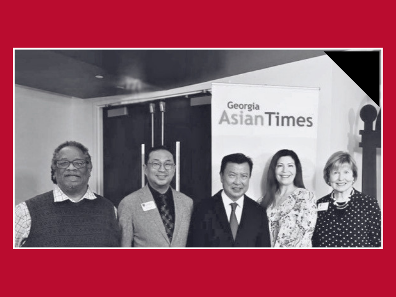 A group of 5th Annual GAT AAPI Summit attendees standing together, posing for a photo.