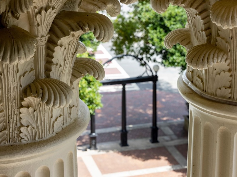 The Arch seen through the columns of the Holmes Hunter Building. (Photo by Dorothy Kozkowski/UGA)